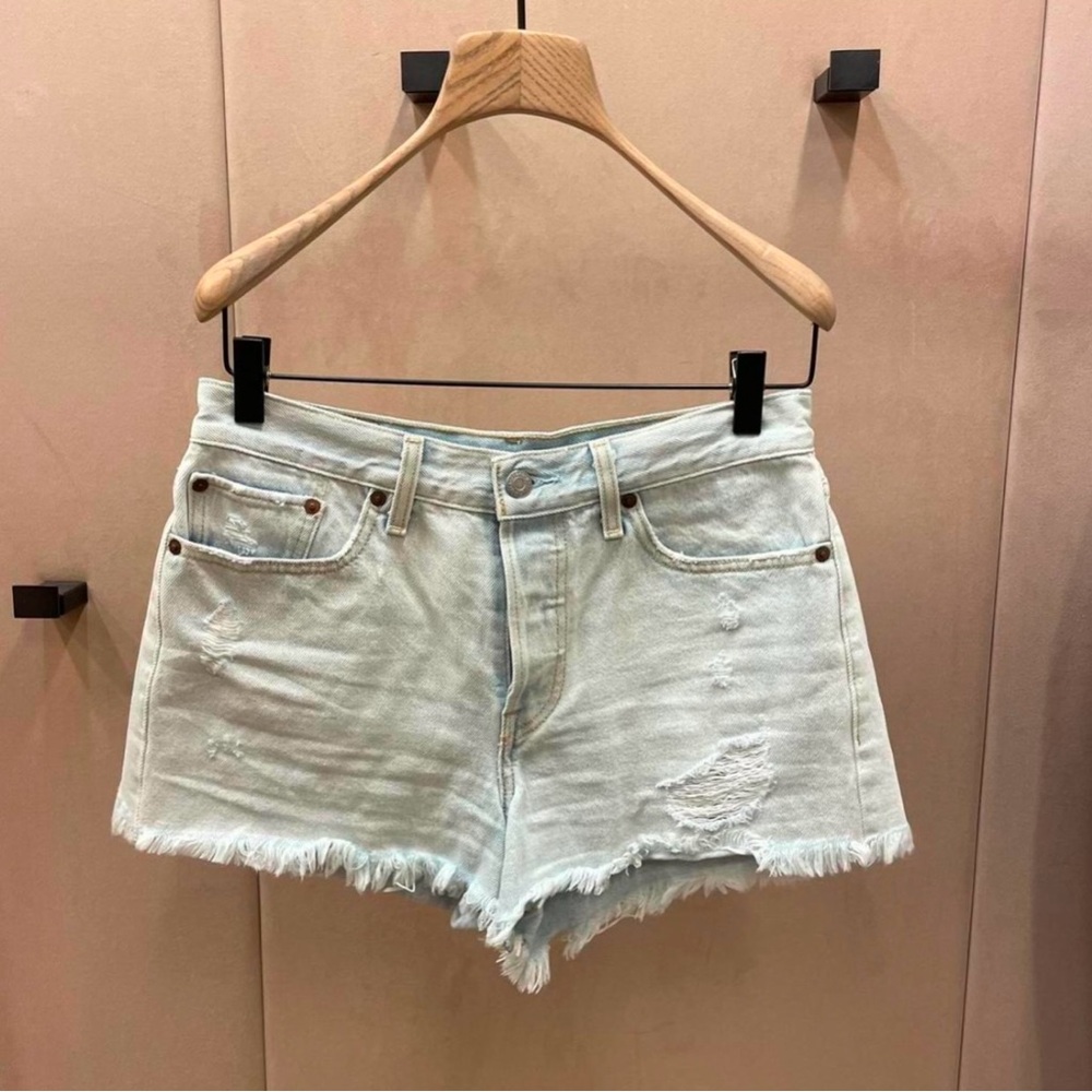 Light wash Levi shorts with raw hem. Purchased from Aritzia